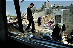 8 oct 2004 ,Gaza, jabaliya refugeecamp.<br><br>Palestinian people find their demolished homes again after beeing distroyed by IDF forces.<br>Israel has been engaged in a week-long army operation around the Jabaliya refugee camp in northern Gaza. <br>As the shooting continues, people protect theselves and the militia fighters with clothes hanging over the alleys to avoid <br>plains to see any movements.<br>The violence in the Camp of Jabaliya is excessive, random shooting is continue and shelling or rockets are very regurly.<br>The victims are the locals and militia who integrated in the camps where they also have their home.<br><br><br>