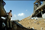 violence in Gaza strip<br><br>8 oct 2004 ,Gaza, jabaliya refugeecamp.<br>A man looks at his distroyed house, but it is still inside the firing zone, so he can not reach it.<br><br>As the shooting continues, people protect theselves and the militia fighters with clothes hanging over the alleys to avoid plains to see any movements.<br>In the meanwhile people find theri demolished homes again after beeing distroyed by IDF forces.<br>