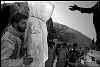 Pakistan, Kashmir  dec2005/febr2006<br>Hatian, distribution of tents, beds and blankets.<br><br>More than 70.000 people have lost their lives during the earthquake in the Pakistan Kashmir regions on October 8.<br>Cities like Balakot , near the epical center report close to 100% destroyed homes that are beyond rebuilding.<br>In the mountain regions of Kashmir, people are difficult to reach and some area's can only be accessed after spring arrives.<br>This creates a huge flood of people that flee the mountains during wintertime, facing the dangerous landslides,<br>to arrive in the hands of the Aid agencies who have a huge task, while some have lack of funding.<br>The fear of total isolation, outbreak of diseases, and traumatized victims is a  long task for the future.<br>In the tents, life tries to find it's rules again, the refugees  try to forget all they have lost and hope for a better future.<br>
